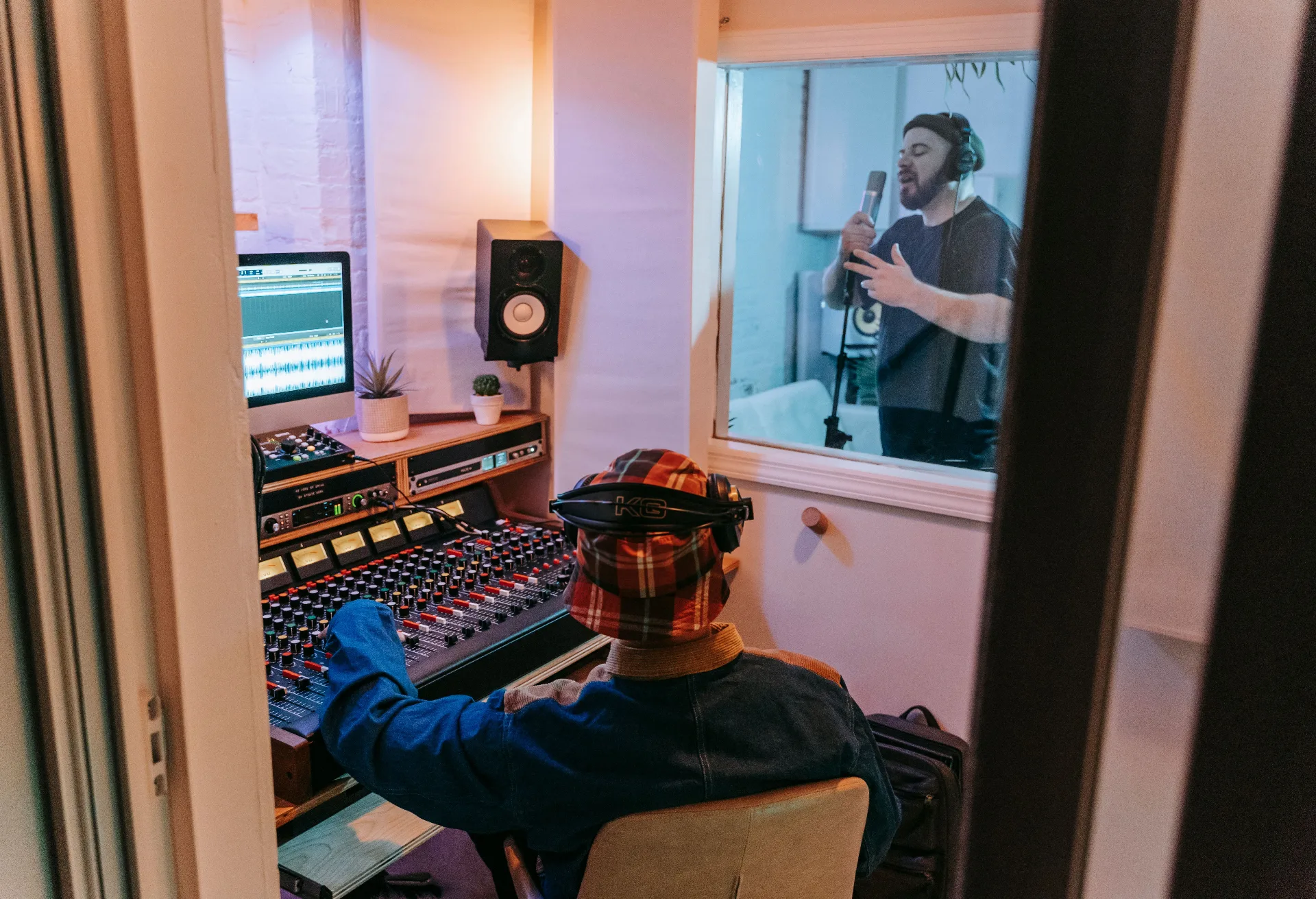 Engineer directing a vocal take